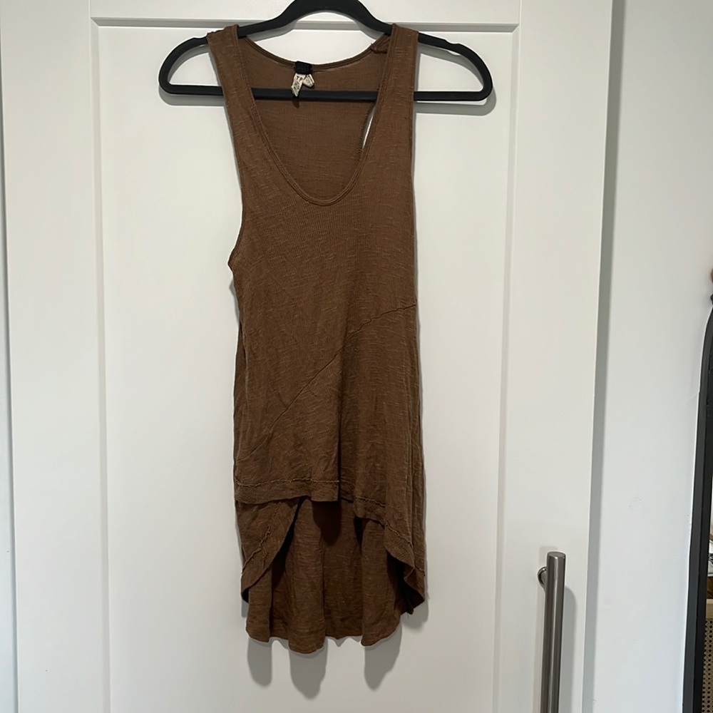 Brown racer back tank top with an assymetrical hem
